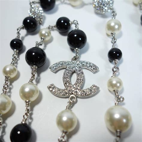 chanel black and white pearl necklace price|chanel long necklace with logo.